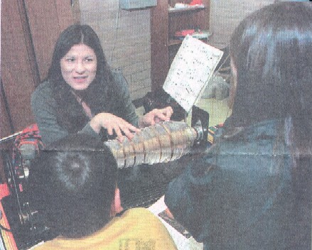 Mayling Garcia plays the glass armonica for Oñate Elementary School students in Albuquerque, NM